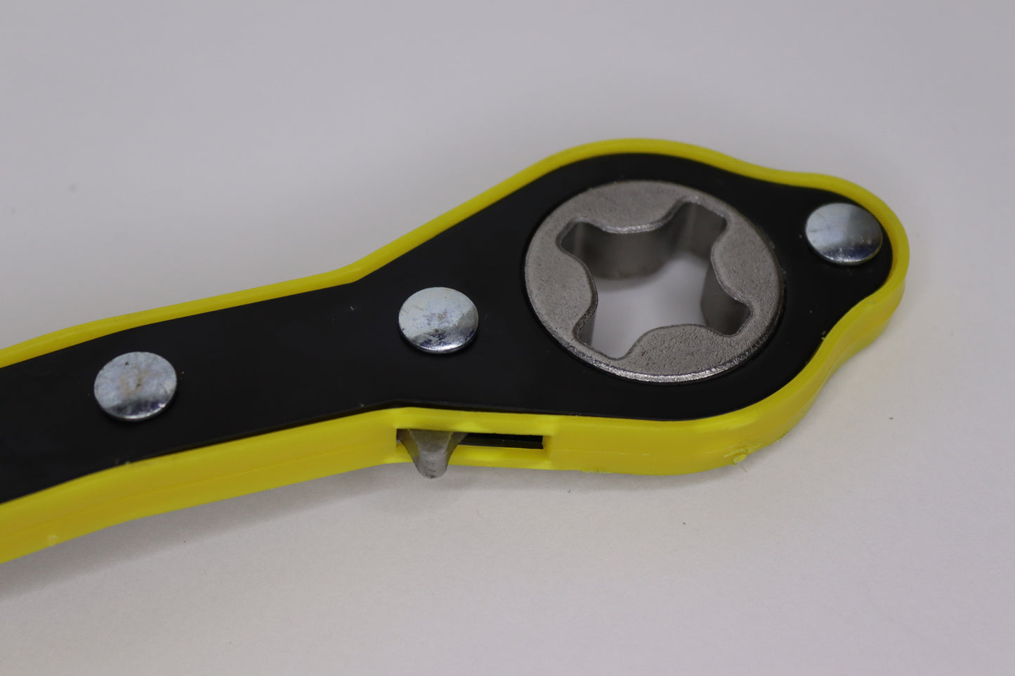A heavy-duty yellow and black car wrenching jack tool with a sturdy metal head and ergonomic handle, designed for securely tightening and loosening car bolts during vehicle maintenance.