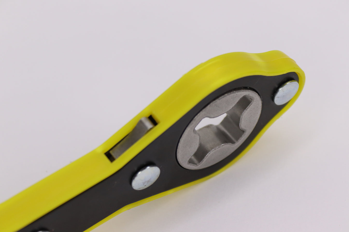 A close-up view of a compact yellow and black car wrenching jack tool with a durable metal grip and ergonomic design, ideal for tightening and loosening car bolts during vehicle repairs.