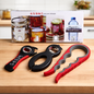 6-in-1 can and jar opener set with three tools and packaging on a kitchen counter.