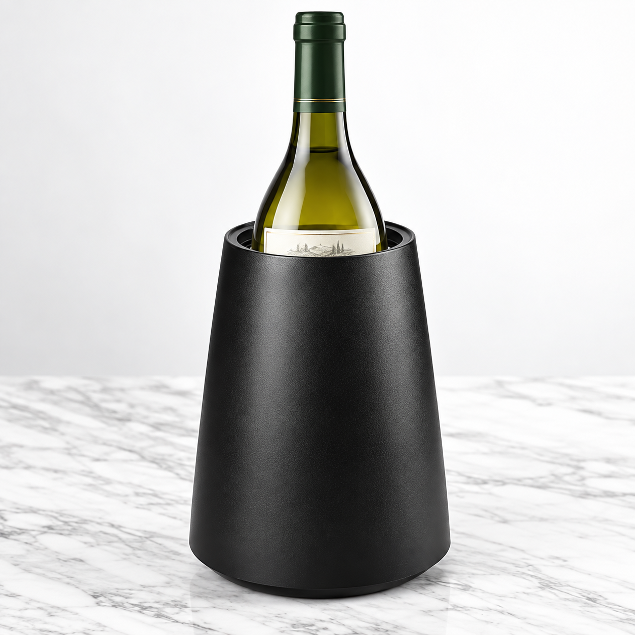 Black insulated wine bottle chiller holding a standard wine bottle on a marble surface.