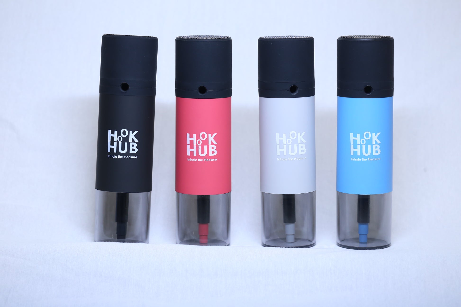 A collection of Hook Hub portable hookah devices in various colors: black, red, white, and blue, displayed side by side to showcase color options.