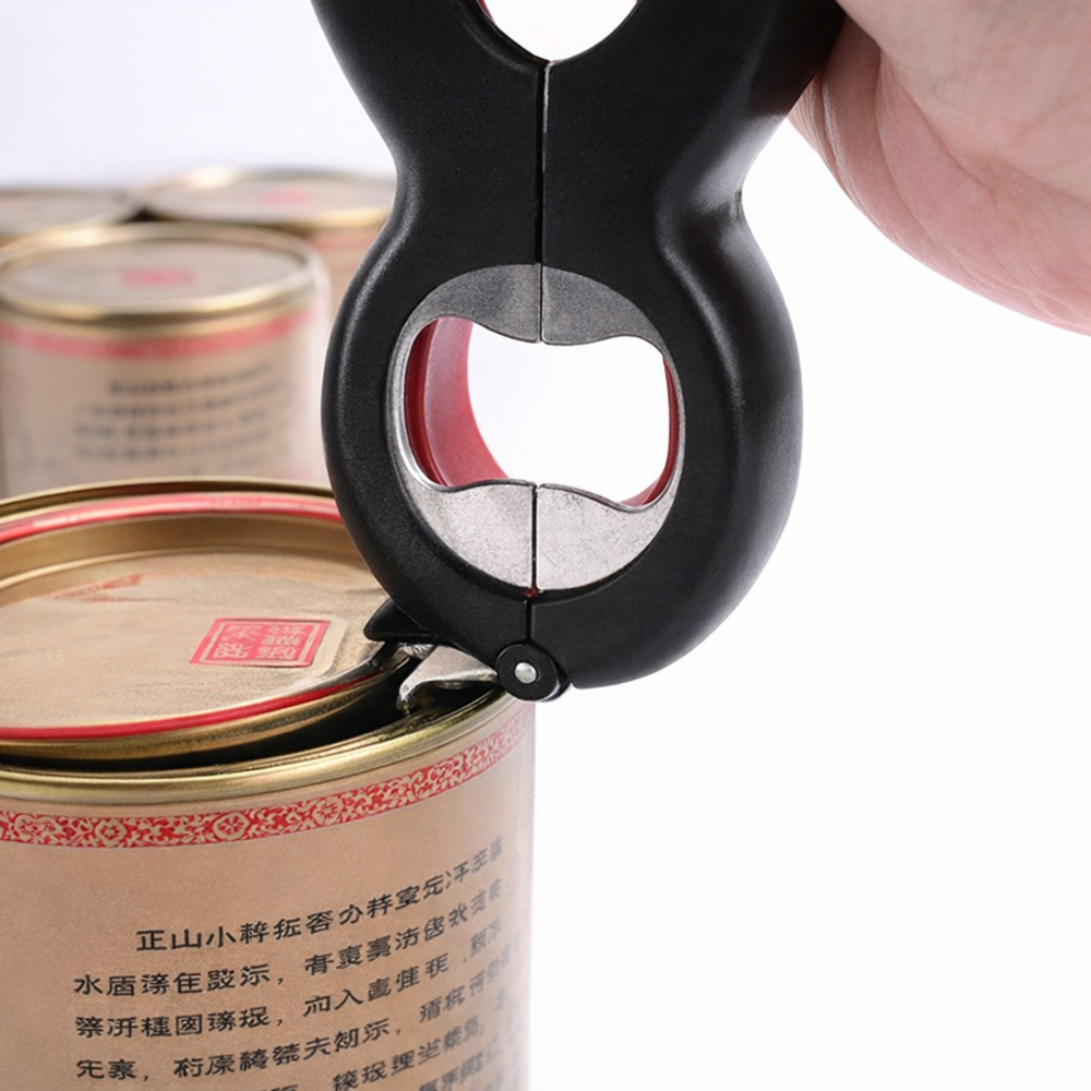 Close-up of a multi-function opener prying up a metal can lid for easy opening.
