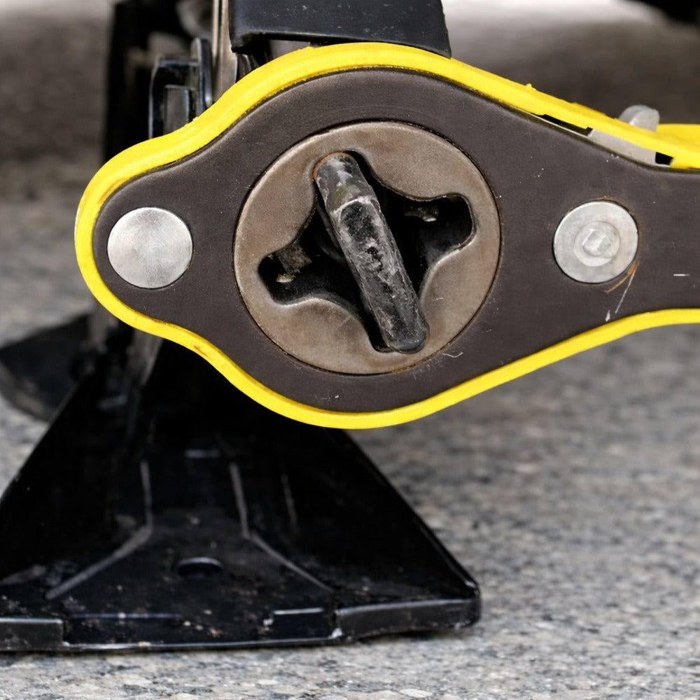 Close-up of the ratcheting jack wrench head with the handle inserted.