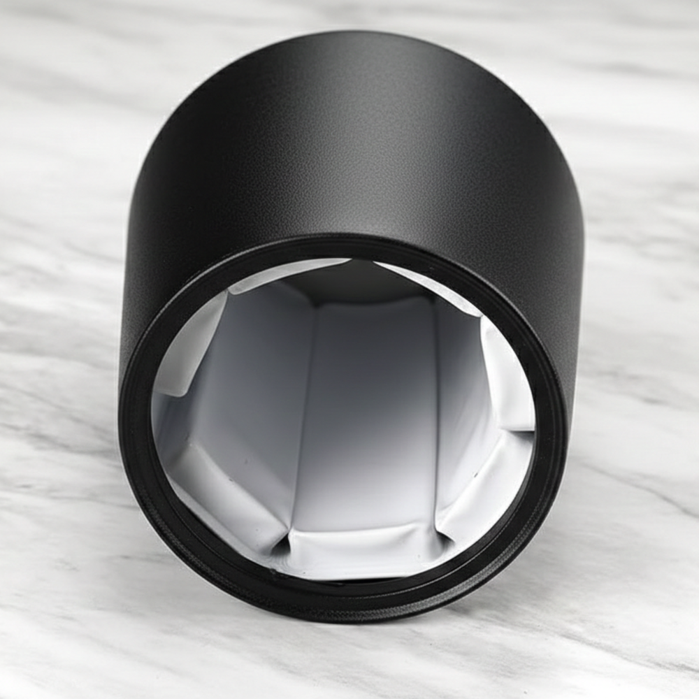 Front view of a black wine bottle chiller showing the insulated white interior